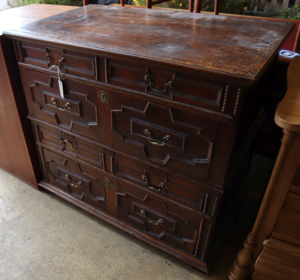 An 18th century oak geometric moulded two part chest of drawers, width 101cm depth 60cm height 91cm